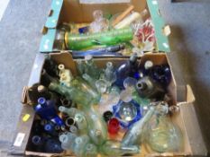 Two trays of assorted glassware to include a selection of advertising glass bottles