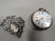 A small continental silver fob watch together with a marcasite cameo brooch in the form of grapes