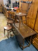 A dropleaf table and four chairs