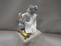 A Lladro figurine of a geisha