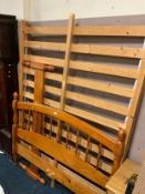 A honey pine double bed frame with fittings and a pine rectangular mirror