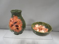 A small Moorcroft vase together with a pin dish (2)