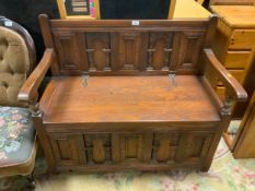 A reproduction oak monks bench W 97 cm