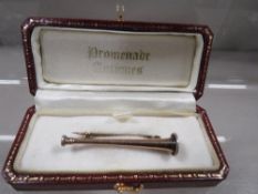 A Victorian hunting horn equestrian brooch marked 9ct