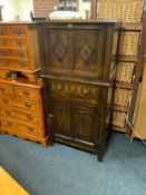 A small oak carved drinks cabinet W 64 cm