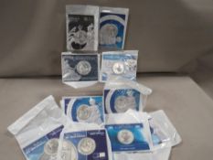 A collection of 11oz silver Britannia coins in Royal Mint cards