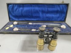 A vintage cased three piece carving set together with a pair of vintage binoculars