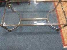 A modern brass & glass coffee table