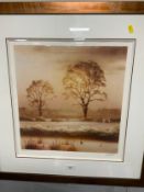 A framed limited edition print of a wintery landscape signed but indistinct 47 x 44 cm