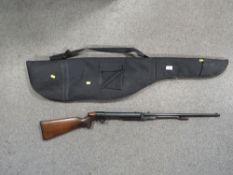 A vintage Lincoln under lever air rifle with wooden stock, serial number 13873 with a modern soft