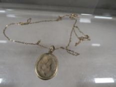 A 19th century pendant with woven hair and enamel detail