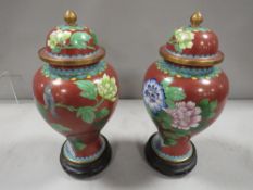 A pair of modern Oriental Cloisonne vases with stands