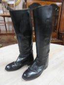 A pair of vintage leather riding boots, with leather straps having buckle adjustment, size 6 ½