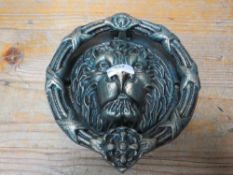 A lion head door knocker**