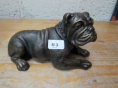 A lying bulldog figure**