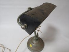A retro cast metal bankers lamp