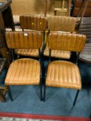 A set of four tan leather modern dining chairs