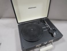A boxed Crosley three speed portable record player