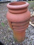 A terracotta chimney pot
