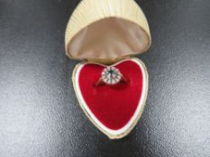 A hallmarked 18ct gold ring set with an aquamarine stone surrounding with diamonds approx. weight