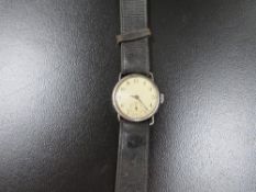 A hallmarked silver cased antique trench wristwatch