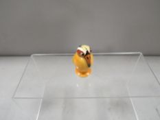 A rare Royal Doulton HN264 Character bird produced early 20th century in limited numbers