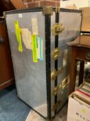 A large metal packing trunk