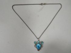A hallmarked silver and enamel Art Nouveau pendant with chain
