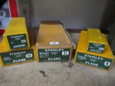 Five boxed Stanley planes / scraper