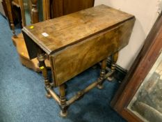 A small antique walnut gate leg table in the William and Mary style