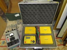 A case of four Robin electrical testers together with a MEGGER earth tester