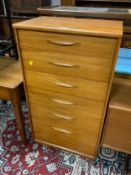 A mid century teak six drawer chest