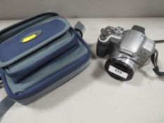 A Panasonic dmc fz28 camera with bag