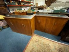 A pair of mid century teak leather topped cabinets W 105 cm. (2)