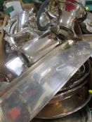 A tray of assorted metal ware to include a silver plated four piece tea service