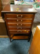 An Edwardian mahogany music cabinet