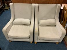A pair of modern upholstered armchairs