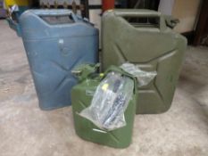 Three jerry cans to include a US Army example, a British Army example with crows foot mark and a
