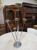 An articulated height adjustable mid 20th century five branch chrome hat display stand