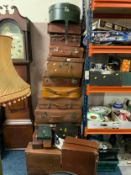 A collection of vintage luggage, suitcases, hat boxes, et cetera