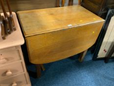 An oak dropleaf table