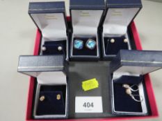 Five boxed pairs of silver earrings etc, together with a loose pair of earrings and a ring