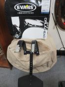 A base drum together with a side snare drum, a snare drum skin and a drum harness