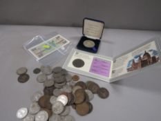 A group of British military banknotes and a quantity of coins