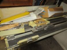 An Empisal knitmaster knitting machine and table