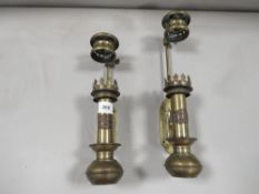 A pair of brass wall mounted adjustable paraffin lamp holders stamped White Star Liverpool