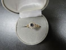 A hallmarked 9 carat gold sapphire and diamond ring approx. weight 2.2g