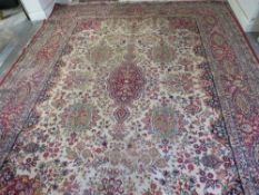 A large woollen carpet approx. 276 x 276 cm