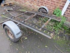 A tandem motorcycle trailer