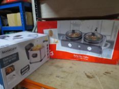 A boxed double slow cooker together with a deep fat fryer